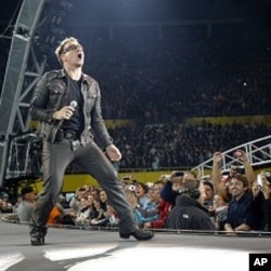 Lead singer Bono of Irish rock band U2 performs during their 360 Degree Tour (file photo)