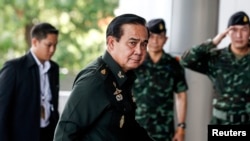 FILE - Thai Army chief General Prayuth Chan-Ocha arrives at the Army Club in Bangkok, June 13, 2014.