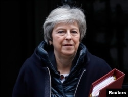 Britain's Prime Minister Theresa May leaves 10 Downing Street in London, Britain, Nov 21, 2018.