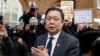 Myanmar's ambassador to the UK, Kyaw Zwar Minn speaks to the media outside the Myanmar Embassy in London, April 8, 2021.
