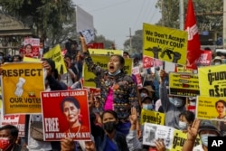 FILE - Demonstrators protest against Myanmar's military junta in Mandalay, Myanmar, Feb. 18, 2021.