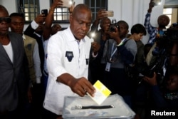 FILE - Martin Fayulu, Congolese joint opposition presidential candidate, casts his vote at a polling station in Kinshasa, Democratic Republic of Congo, Dec. 30, 2018.