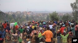 FILE - People who fled from their homes following recently attacks by assailants take refuge at a camp for displaced people in Bunia, Eastern Congo, Feb. 17, 2018.