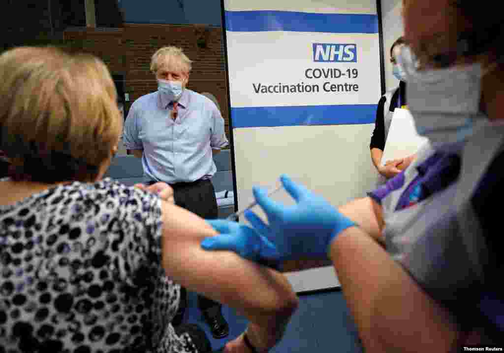 British Prime Minister Boris Johnson visits Guy's Hospital on the first day of administering a coronavirus vaccine in London, Dec. 8, 2020.