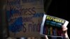 Protesters hold placards at the 'Stand up for Refugees' rally held in central Sydney, October 11, 2014.