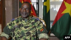 FILE - General Gilbert Diendere sits at the presidential palace in Ouagadougou, Sept. 17, 2015. Soldiers were arrested for plotting to free Diendere from prison.
