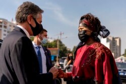 Secretary of State Antony Blinken, accompanied by Senegalese Foreign Minister Aissata Tall Sall, departs following a news conference at the Ministry of Foreign Affairs in Dakar, Senegal, Saturday.