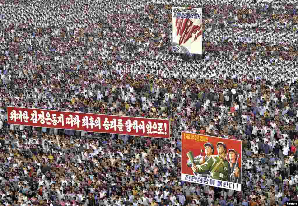 People attend a mass rally against "U.S. Imperialists" at Kim Il Sung Square in Pyongyang in this undated photo released by North Korea's Korean Central News Agency (KCNA).
