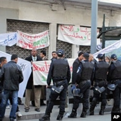 Riot police blocking a teachers strike for better benefits in Algiers