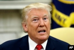President Donald Trump talks to the media after new White House Chief of Staff John Kelly was privately sworn in during a ceremony in the Oval Office, July 31, 2017, in Washington.