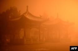 Pagodas are seen on a polluted day in Hohhot, north China's Inner Mongolia region. Northern China choked under some of the worst smog this year on Nov. 30, with Beijing's pollution soaring to 22 times healthy limits. Photo taken Nov. 29, 2015.
