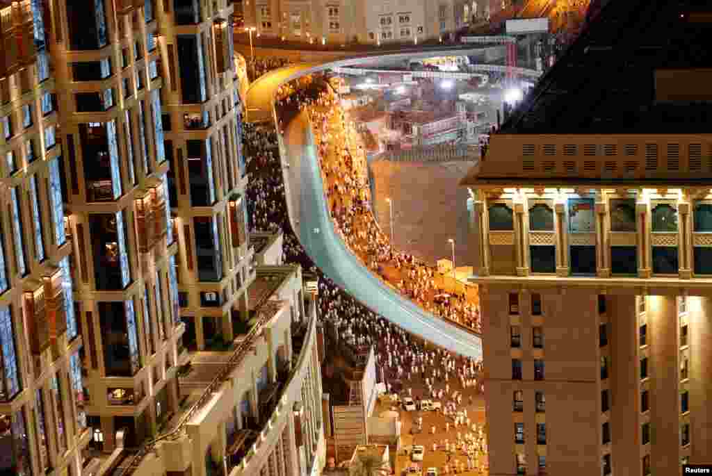 Muslims leave the Grand Mosque in Mecca, Saudi Arabia, as the participate in the annual hajj pilgrimage.