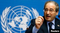 Syrian Deputy Foreign Minister Fayssal Mikdad addresses the media after a meeting at the Geneva Conference on Syria at the United Nations European headquarters in Geneva, Feb. 14, 2014.