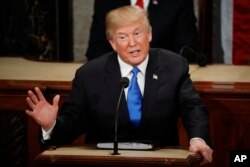 FIlE - In this Jan. 30, 2018 file photo, President Donald Trump delivers his State of the Union address to a joint session of Congress on Capitol Hill in Washington.