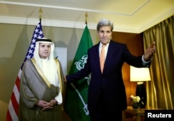 U.S. Secretary of State John Kerry (R) gestures next to Saudi Foreign Minister Adel al-Jubeir during a meeting on Syria in Geneva, Switzerland, May 2, 2016.