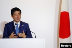 Japan's Prime Minister Shinzo Abe answers a question during a press conference with U.S. President Barack Obama after a bilateral meeting during the 2016 Ise-Shima G7 Summit in Shima, Japan May 25, 2016.