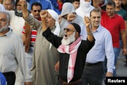 A man shouts anti-Saudi slogans as he takes part in a protest against the execution of Saudi Shi'ite cleric Nimr al-Nimr by Saudi authorities, in the village of Sanabis, west of Manama, Bahrain, Jan. 2, 2016.