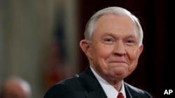 FILE - Attorney General Jeff Sessions of Alabama smiles as he testifies on Capitol Hill in Washington, Jan. 10, 2017.