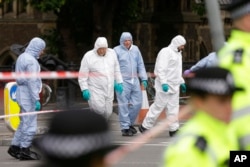 Forensic police investigate an area in the London Bridge area of London, June 5, 2017.
