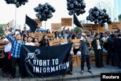 Myanmar press freedom advocates and youth activists hold a demonstration demanding the freedom of two jailed Reuters journalists Wa Lone and Kyaw Soe Oo in Yangon, Myanmar, Sept. 16, 2018.