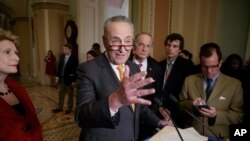 Senate Minority Leader Charles Schumer of N.Y., speaks with reporters following a closed-door strategy session, March 28, 2017, on Capitol Hill in Washington.