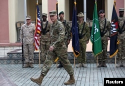 FILE - Commander of NATO Resolute Support forces and United States forces in Afghanistan, U.S. Army General John Nicholson walks during a change of command ceremony in Resolute Support headquarters in Kabul, Afghanistan, March 2, 2016. U.S.-led NATO forces ended their combat mission in Afghanistan at the end of 2014 but continue to provide training and support.