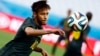 Brazil's Neymar eyes the ball during his team's final practice in Sao Paulo one day before the opening match of the soccer World Cup between Brazil and Croatia, June 11, 2014. 