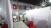 FILE - Nurses from the Tata Memorial Hospital stand inside a temporary facility created to screen cancer patients for COVID-19 in Mumbai, India, July 30, 2020.