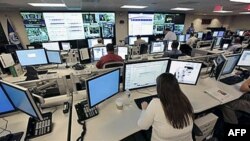 FILE - The National Cybersecurity & Communications Integration Center (NCCIC) prepares for the Cyber Storm III exercise at its operations center in Arlington, Virginia, Sept. 2010.