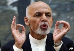Afghanistan's President Ashraf Ghani talks during a press conference at presidential palace in Kabul, Afghanistan, Oct. 1, 2015. Ghani condemned the beheadings 'in the strongest terms.'