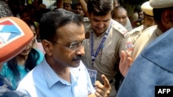 FILE - Arvind Kejriwal, leader of the opposition Aam Aadmi Party, shows his inked finger after voting in New Delhi, May 25, 2024. Kejriwal was arrested earlier this year on corruption allegations stemming from a bribery investigation, but a court granted him bail on June 20.