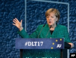 German Chancellor Angela Merkel of the Christian Democrats delivers a speech during a meeting oh her party's youth wing in Dresden, Germany, Oct. 7, 2017.