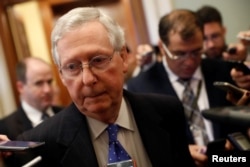 FILE - Senate Majority Leader Mitch McConnell speaks to reporters about allegations made against Alabama senate candidate Roy Moore on Capitol Hill in Washington, Nov. 9, 2017.