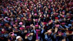 School girls wearing pink turban, a head covering, wave during celebrations of International Day of the Girl Child 2018, at a school in Chandigarh, India October 11, 2018. (REUTERS/Ajay Verma)