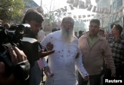 Salahuddin Ahmed, a Bangladesh Nationalist Party (BNP) candidate for general election, is seen bleeding as he was stabbed on a election day in Dhaka, Dec. 30, 2018.