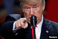 U.S. President Donald Trump speaks at a rally in Pensacola, Fla., Dec. 8, 2017.