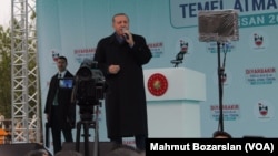 FILE - Turkey's President Recep Tayyip Erdogan speaks to supporters during a rally ahead of the upcoming referendum, in the pre-dominantly Kurdish city of Diyarbakir, in southeastern Turkey, April 1, 2017.