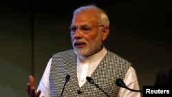 FILE - India's Prime Minister Narendra Modi speaks at the inauguration of a hydroelectric power plant in the state of Jammu and Kashmir, at Sher-i-Kashmir International Conference Centre in Srinagar, May 19, 2018.