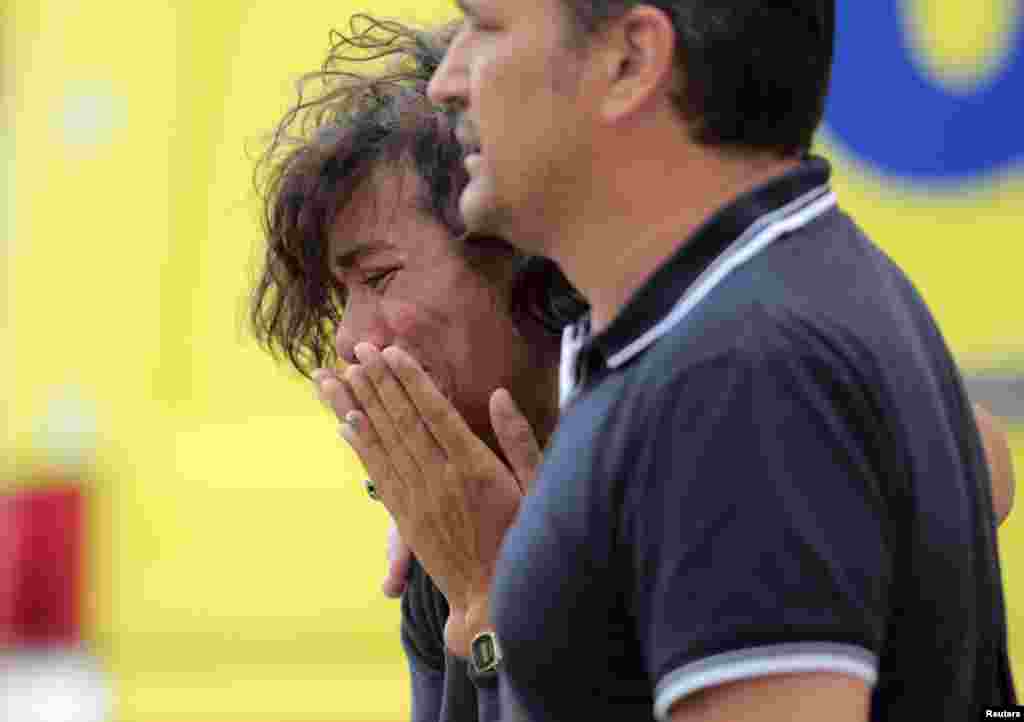 A relative of one of the victims of the train crash reacts in Santiago de Compostela, northwestern Spain, July 25, 2013. 