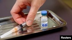 FILE - A vial of the measles, mumps, and rubella virus (MMR) vaccine is pictured at the International Community Health Services clinic in Seattle, Washington, March 20, 2019.