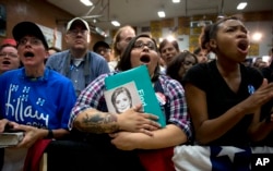 Supporters call out as Democratic presidential candidate Hillary Clinton speaks during a campaign event at Carl Hayden Community High School in Phoenix, Arizona, March 21, 2016.