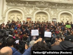 Tunisian activist speaks in front of anti-government protestors in Tunis, Tunisia, Jan. 10, 2018 in this picture taken from social media.