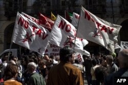 No Tav (No high speed train) demonstrators gather in Turin during one of several rallies against unemployment in Italy as people across the world mark May Day in Turin, May 1, 2019.