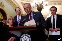 FILE - Senate Minority Leader Chuck Schumer of N.Y. speaks to members of the media on Capitol Hill in Washington, April 2, 2019.