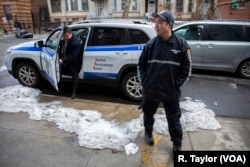 Louie Liu, left, chairman of Brooklyn Asian Civilian Observation Patrol (BACOP), says the Chinese community’s relationship with law enforcement has improved since the patrol began five years ago.