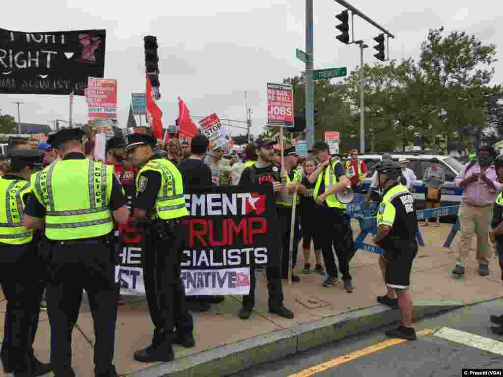 First clash with police. Counter-protestors stopped because of picket signs.
