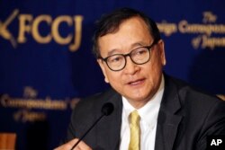 FILE - Cambodia's self-exiled opposition leader Sam Rainsy speaks during a press conference in Tokyo, Japan, In this April 13, 2018.