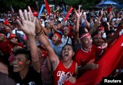 FILE - Supporters of Myanmar's pro-democracy figurehead Aung San Suu Kyi gather outside National League for Democracy headquarters (NLD) in Yangon, Myanmar, Nov. 9, 2015.