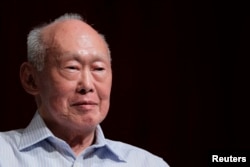 FILE - Lee Kuan Yew (LKY) smiles as he attends the LKY School of Public Policy 7th anniversary dialogue session in Singapore, Sept. 2011.