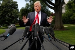 President Donald Trump speaks to the media on the South Lawn of the White House in Washington, May 23, 2018, en route to a day trip to New York.